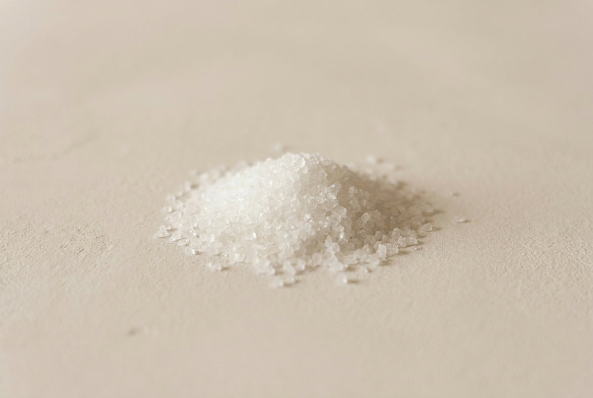 Citric acid, the colourless crystalline powder, odourless and water-soluble, and nothing else.