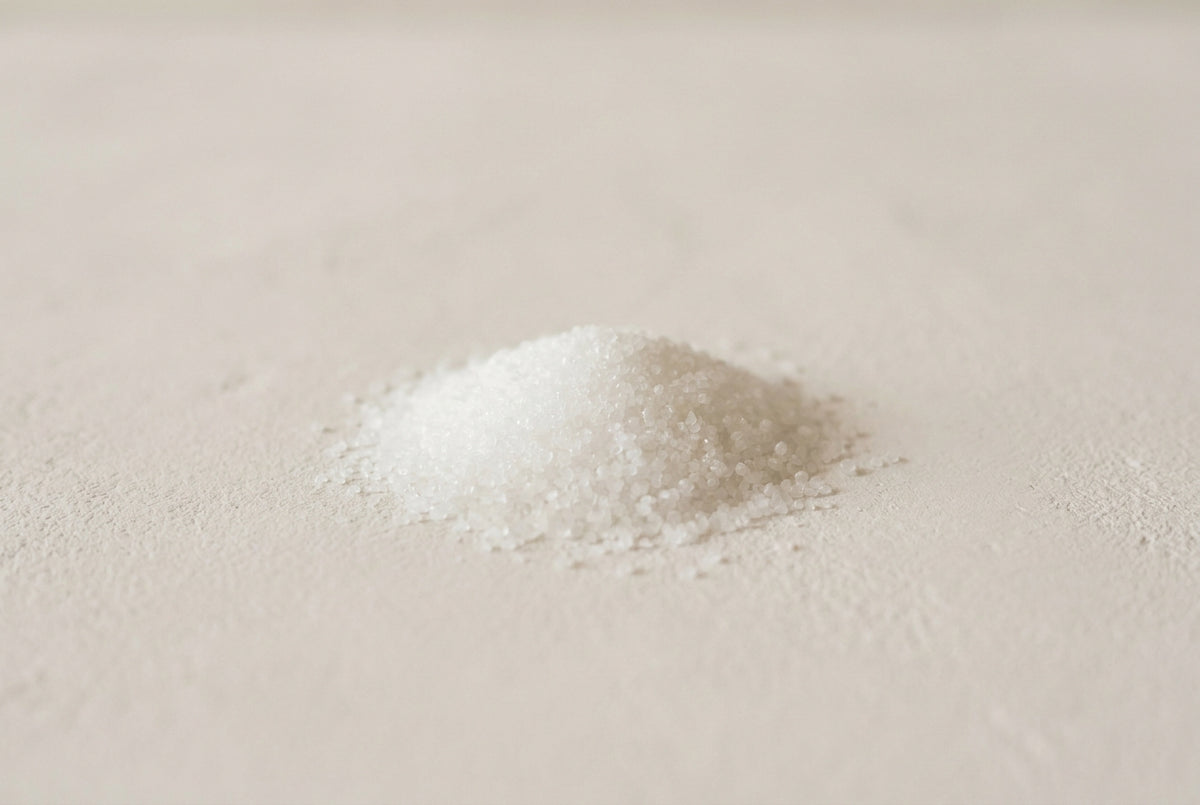 Sodium hydroxide, the white deliquescent solid, weighed dry and dissolved to a dilute solution before it meets a formula.